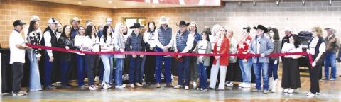 LEVELLAND HORSE SALE RIBBON CUTTING-- The Levelland Horse Sale celebrated it official rebranding with a ribbon cutting this past Friday to kick off the horse and stockdog sale. Owner Steve Friskup, Charlie Rogers and their families were joined by the Chamber of Commerce, city and county officials, as well as State Rep. Ken King to usher in the business which will be a boon to Levelland. (Staff photo)