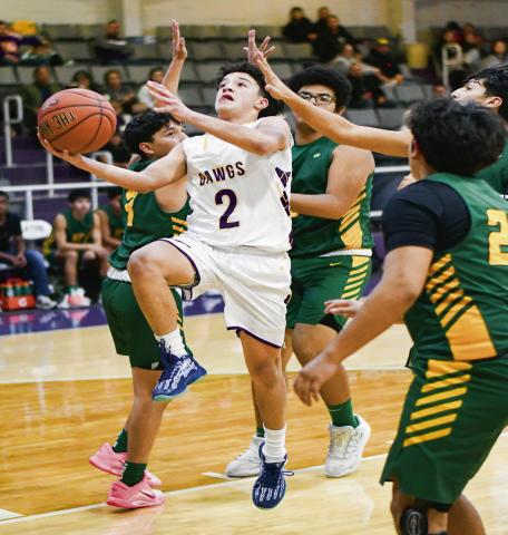 ALAFA SPLITS THE DEFENSE - Anton’s Isaiah Alafa splits four Springlake-Earth defenders during their game this past Friday night in Anton. (Staff photo by Jentezen Smith)