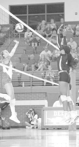BLOCK - Levelland athlete Tanaeasia Brackens went up to block the Denver City athlete during their first scrimmage of the season. (Staff photo by Aalijah Soliz)