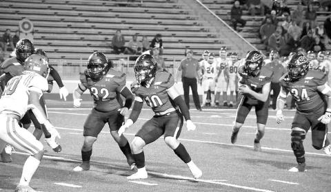 LOBOS COME UP SHORT- Facing off against the Monahans Loboes in the 4A-2 Bi-District round, the Levelland Lobos fell short of extending their season as they lost, 27-15, Thursday in Andrews. Pictured in the photo are: Rusty Johnson (10) Aiden Herrera (32), Marco Guillen (34) and Konner Alexander (7). (Staff Photo by Dom Puente)