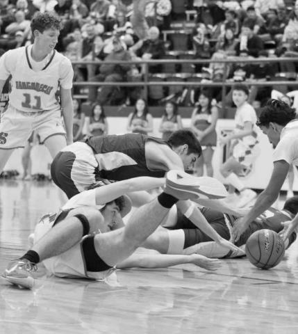SCRAMBLE - Whiteface Antelope Cesar Chavez and Sundown Roughnecks Nathan McAdams and Nathan Flores fought for the loose ball during the team’s game this past Tuesday. (Photo courtesy of Holly Crutcher)