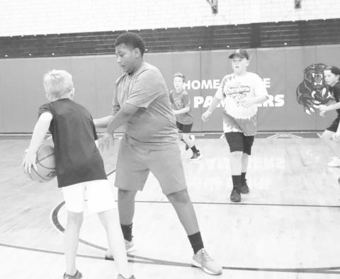 DEFENSE - Whitharral students Brashon Robinson and Brady Holt went head-to-head during the basketball portion of camp at the Whitharral All-Sports Camp this week. (Staff Photo by Aalijah Soliz)