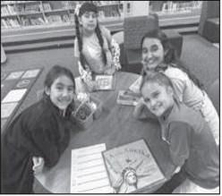 CELEBRATE FREEDOM WEEK-- Capitol Elementary students wrapped up Celebrate Freedom Week last week in the library with Mrs. Alexander. Students read a variety of books, wrote poems, discussed what they value about their freedom, what freedom means to them, watched a podcast of a book about our Founding Fathers, and learned a song and poem about the Preamble to the Constitution. Pictured are Addisyn Garza, Jamisyn Garza, Makenzie Del Campo, Samantha Villalba (Levelland ISD photo)