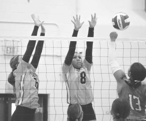 VERTICAL - Levelland Loboettes Hailiee Estrada and Mia Sepulbeda went up to block the Lake View Maidens shot last Tuesday night on the road during district play. (Staff photo by Aalijah Soliz)