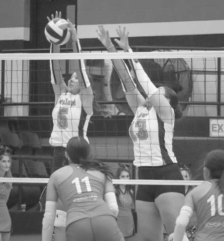 BLOCKED - Levelland Loboettes Allison Monge and Diana Roman blocked the spike from the Denver City Lady Mustang this past Tuesday during their season opener. (Staff photo by Aalijah Soliz)