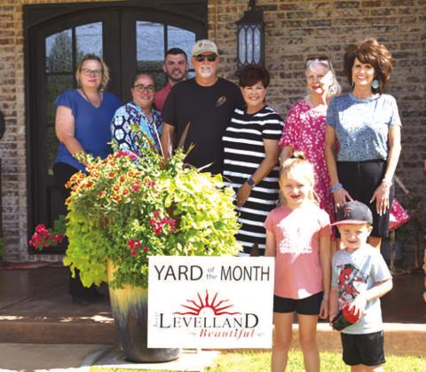YARD OF THE MONTH - July Yard of the Month was awarded to Ricky and Desiree Huckeby by Keep Levelland Beautiful. Names in no particular order: Rick Huckeby, Desiree Huckeby, Jaine Morales, Kristal Isaack, Dona Wheeler, Kelly Handcock, Josh Meredith, Kynlie Greeson, Lukas Greeson. (Staff photo by Emily Campos)