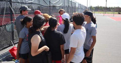 BREAK - Levelland Tennis camp breaks it out at the end of practice during Levelland two-a-days. (Staff Photo by Aalijah Soliz)