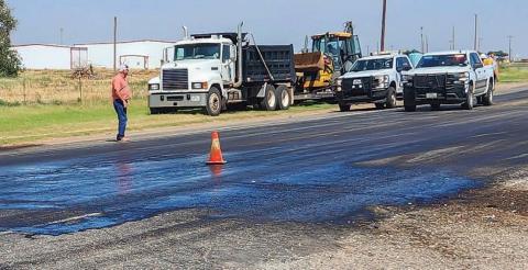 Crews from TxDOT and local contractors worked an oil spill cleanup that was caused when a transformer fell off a transport truck, Tuesday, at the intersection of Highway 114 and FM 1780 in Whiteface. The Whiteface Fire Department and Cochran County Constable provided traffic control before TxDOT units arrived. (Photo courtesy of Jay Kelley)