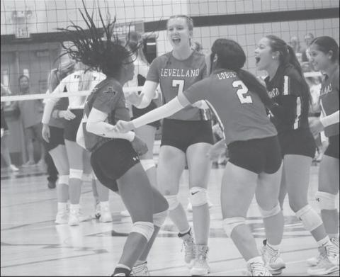 HYPED - Levelland Loboettes were excited as the swarmed Tanaesia Brackens for the great point she earned for the team. The Loboettes started district play this past Saturday as the away team against a decent Sweetwater team. (Staff photo by Aalijah Soliz)