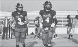 DUO - Morton athletes AJ Mendoza and Lane Lyon were getting the playcall from the coaches on the sideline during the teams homecoming game last Friday. (Staff photo by Aalijah Soliz)