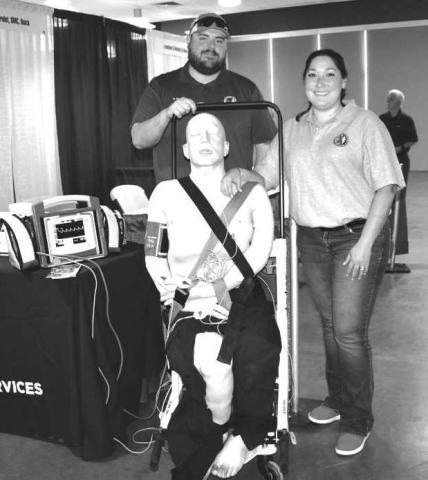 DUMMY GEORGE:There was a Dummy they named George at the Fall 2023 Career Exploration Event on Thursday at the Mallet Event Center. The dummy was to teach medical procedure to the students as they stopped by the booth for information. Pictured is Scott and Nicole Crabey.(Staff photo by Emily Campos)