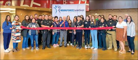 JOB FAIR - The Workforce Solutions of the South Plains hosted the Levelland Job Fair for area 8th graders to visit with local employers about possible career paths. Over 30 employers participated and 300 8th graders from various schools within the area attended the event. Pictured is the Levelland Chamber of Commerce hosting a ribbon cutting with the vendors including Workforce Solutions who were all present at the event. The job fair was held at the Mallet Event Center. (Photo courtesy of Mary Siders)