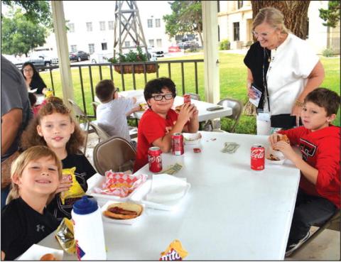 OUTDOOR FUN - Miss Utley’s Class from Capital Middle School GT 3rd grade class were out at the Hockley County Court House Gazebo on Thursday doing their project about food trucks. Pictured in no particular order are: Morgan Cambell, Kale DeArmond, Qynley Winn, Bryan Jordan, Herisson, Randell, Eric Rendon.(Staff photo by Emily Campos)