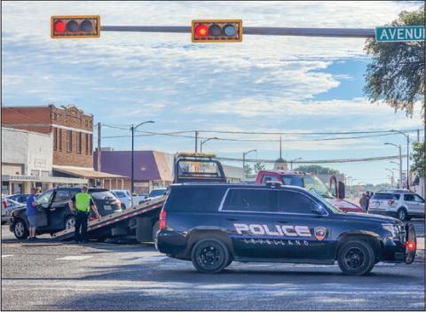 DOWNTOWN WRECK - The Levelland Police Department responded to a report of a two-vehicle wreck that occurred at the intersection of Avenue H. According to officers on the scene, no injuries were reported from the incident. Both vehicles had to be removed from the scene by wrecker services. (Staff photo by Dom Puente)