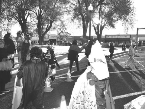 LION CLUBS FUN- The Lions Club Participated in the Trunk -or- Treat Event on Tuesday around the Courthouse. The Lions Club had a cake walk for the families and children that participated in the event. (Staff photo by Emily Campos)