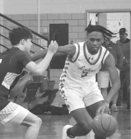 DETERMINATION - Levelland Lobo Eryk Jones broke the full court press with his combination of speed, strength and size during the teams first game of the Littlefield tournament against the Hale Center Owls. (Staff photo by Aalijah Soliz)