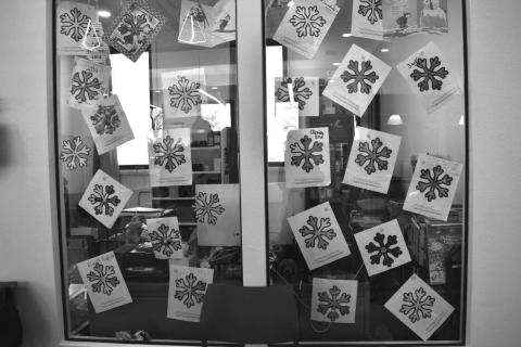 SNOW FLAKES- At the ribbon cutting in sundown On Monday for the new Sundown Library, There were Many great creative snow flakes that the students from Sundown School made to display on the windows of the new library as you can see in the photo they were so nice.(Staff photo by Emily Campos).