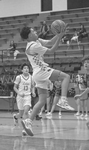 FASTBREAK - Levelland Lobo Ozzie Solano layed the ball up during the teams game against the Lakeview Chiefs in the teams district win last Tuesday night. The teams last game is this Tuesday against the Snyder Tigers on the road. (Staff photo by Aalijah Soliz)