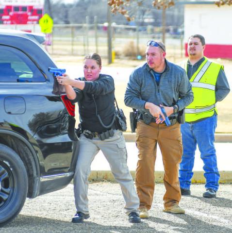 ACTIVE SHOOTER TRAINING - In an effort to provide a new Levelland Police officer and a handful of new South Plains College officers active shooter training to bridge the gap before their ALERRT Level One training in the future, the LPD put together an eight-hour active shooter training module to teach the new officers the basics and fundamentals of navigating these type of incidents. Pictured are officers working on entering the Levelland Intermediate School in a safe manner. (Staff photo by Dom Puente)