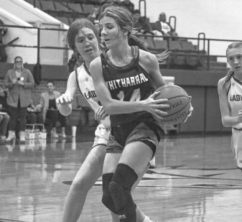 NO EASY SHOTS - Whitharral Lady Panther Paige Smith got out on the fastbreak with Whiteface Lady Lope Hannah Blankenship right behind her to contest the shott. (Staff photo by Aalijah Soli
