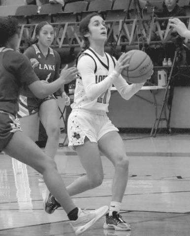 DRIVE - Levelland Loboette Carly Tienda drove the ball in the middle of the defense to get the team a good look on offense last Tuesday night. (Staff photo by Aalijah Soliz)