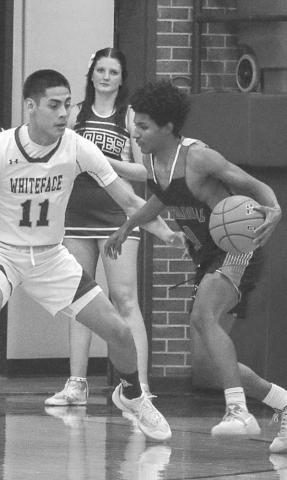 1-ON-1 - Whiteface Antelope Jeremias Chavez guarded Brent Robinson during the team’s contest last Friday night. (Staff photo by Aalijah Soliz)