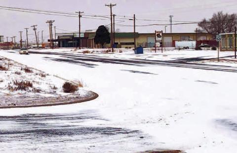 HAZARDOUS ROAD CONDITIONS - Much of the West Texas area including portions of the Panhandle and New Mexico area saw various amounts of snowfall over the weekend heading into Monday. Icy conditions were reported throughout Hockley and Lubbock County cautioning drivers to practice safe driving methods and add extra time for commuting in the early morning of Monday. Various school districts and colleges postponed classes or opted for a 10 a.m. delay. Pictured is the intersection of Highway 114 and Avenue H, Su