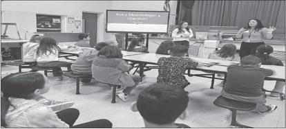 SCIENCE CLASS - South Elementary second graders have been studying the weather in their science class. The students recently completed their weather unit following a presentation from National Weather Service Meteorologists Marissa Pazos and Jordan Salem who visited the students from the Lubbock Weather Forecast Office. Levelland community members are reminded that LHS is a safe shelter in the case of a tornado. Pictured are Pazos and Salem speaking to a class of South Elementary second graders. (Photo subm