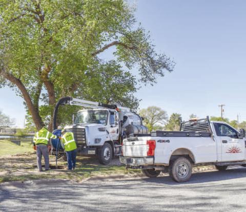 WATER LINE FISHING - The City of Levelland Public Works Department was busy Thursday morning fixing water line issues next to Lobo Lake. The small crew worked in the area quickly to remedy the issues. (Staff photo by Emily Campos)