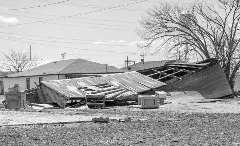 COLLAPSED BUILDINGS – Older buildings throughout Levelland took the brunt of the wind from Wednesday’s storm. Multiple older buildings with little structural rigidity were found collapsed where they once sat or in roadways blown over. Efforts to address major debris or structures in the roadways have been prioritized for resident travel. Pictured is a collapsed building on 3rd Street. (Staff photo by Dom Puente)