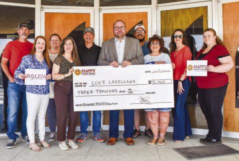 WONDERFUL SUPPORT - The Wallace Theater Board announced the Love Levelland Benefit Concert featuring the Jenni Dale Lord Band, held at Bolen Vineyards raised a total of $7,300 in support of Love Levelland’s vital community initiatives. Pictured from the front row, left to right are: Alycyn Keeling, Tania Moody, Trey Saldana, Lee Ann Paxton. In the back row, from left to right are: Rowdy Bolen, Jolenna Carter, Dallas Pena, Randal Ramirez, Iris Keeling and Tina Wiiest. (Staff photo by Emily Campos)