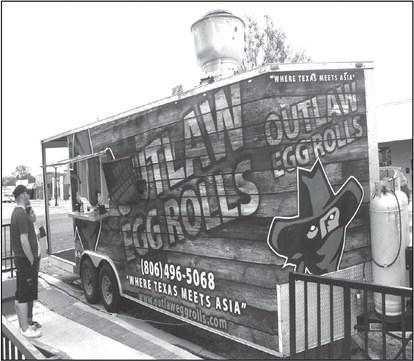 FOOD TRUCK- The OUTLAW EGG ROLLS food truck was one of the food trucks that was participating in Food Truck Thursday which was held at the Hockley County Courthouse Square. Food Truck Thursday is a monthly event held by the Main Street Program that allows the community an opportunity to try something different. (Staff photo by Emily Campos)