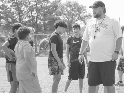 COACHING - Morton Coach was teaching the kids how to do some lineman drills this past Thursday at the Morton High School where they learned things such as snapping the ball. (Staff photo by Aalijah Soliz0