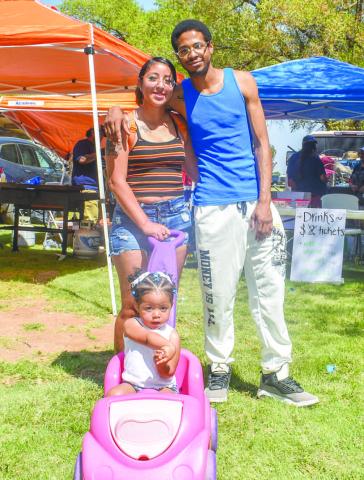 FAMILY FUN-The Duncan family was one of the many families that attended the Jamaica in Morton on Sunday. Pictured is Maria and Mac and daughter Yalanii Duncan. The family enjoyed the various games, music and food booths at the event.(Photo courtesy of Emily Campos)