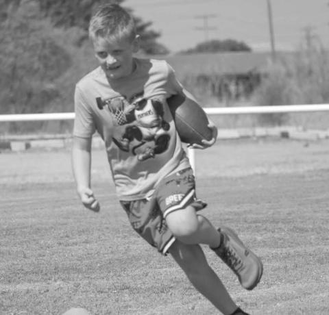 QUICK CUTS - Whitharral Panther Lincoln Griffith ran the football this past Monday at the Whitharral All-Sports Camp at the football field. (Staff photo by Aalijah Soliz)