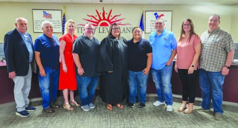 NEW MUNICIPAL COURT JUDGE - During a special meeting held Monday evening by the Levelland City Council, former Municipal Court Clerk Esmeralda Rowand was appointed as the new municipal court judge following the unanimous approval of the Council. Rowand has accumulated 20-plus years of experience in her former position. Pictured from left to right are: Councilman Bill Powell, Councilman Max Ledesma, Mayor Breann Buxkemper, husband Michael Rowand, Municipal Court Judge Esmeralda Rowand, son Luke Rowand, son B