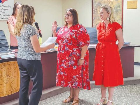 BITTERSWEAT ACCOMPLISHMENT - At the beginning of a special meeting held Monday evening by the Levelland City Council, former Municipal Court Clerk Esmeralda Rowand was appointed as the new municipal court judge following the unanimous approval of the Council. Pictured is City Secretary Andrea Corley administering the Oath of Office to Municipal Court Judge Esmeralda Rowand alongside Mayor Breann Buxkemper. Following her appointment, Rowand thanked the Council for the opportunity as well as thanking her fami