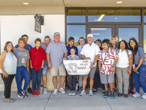 BUTCH’S RAT HOLE DONATION – Butch’s Rat Hole & Anchor Service donated $10,000 for SPECO’s food truck. Pictured, from left to right: Gloria Gamez, Missy Patton, Anthony Avalos, Brendyn Stanley, Diego Alvarado, Scott Bryant of Butch’s Rathole, Anthony Moore, Bobbie Hendon, Donnie Hoover, Mark Franklin of Butch’s Rathole, Jasmine Chino, Elijah Jourden, Keely Kent, Yesenia Maldonado and Cande Jackson. (Staff photo by Evin Thomas)