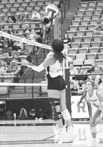 TIPPED OVER - Levelland Loboette Mia Sepulbeda tipped the ball over the net against the Seminole Maidens last Tuesday on the road. The Loboettes start district play this Saturday at 12 p.m. against the San Angelo Lake View Maidens. (Staff photo by Aalijah Soli