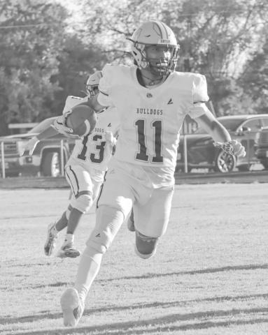 OUT MY WAY - Anton Bulldog Jose Avalos ran the ball to the right side of the field Sept 5 in the team’s win against the Dragons on the road. (Staff photo by Aalijah Soliz)