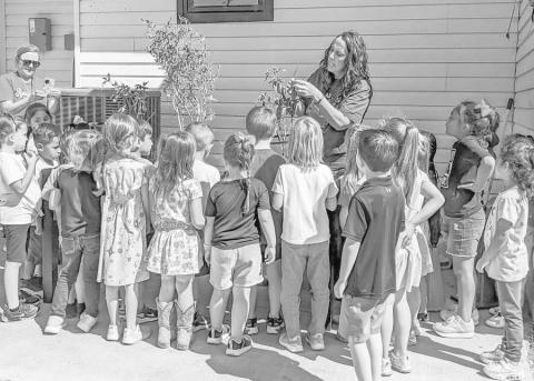LIBRARY’S LITTLE HELPERS - The kindergarten class of Sundown ISD has adopted the City of Sundown Library as its annual service project. Veteran teacher Stacey Buchanan approached Director A’ndrea McAdams and asked if they could help the library. It was perfect timing as McAdams was finalizing the Parkhill Building Community grant by adding plants to the front landscaping. On October 7, the two teachers–Buchanan and Jacei Barrera–walked the students a block to the library. Upon arrival, McAdams read a book p