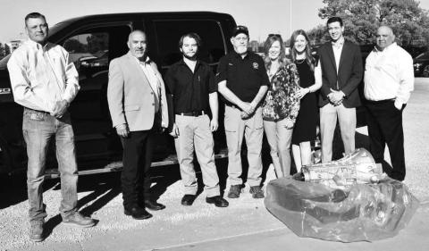 TRANSMISSION DONATION - Smith Auto Family and Ford Motor Company donated a transmission to South Plains College’s automotive technology program on Oct. 15 at the Levelland campus. Pictured from the left are SPC’s Jimmy Stratton, chairperson of the Industrial Technology Department; Albert Garcia, dean of technical education; Shelton Foos, instructor of automotive technology; and Gary Ham, professor of automotive technology; along with Smith Auto Family’s Annette Sykora, dealer principal; Nicole Campbell, gen