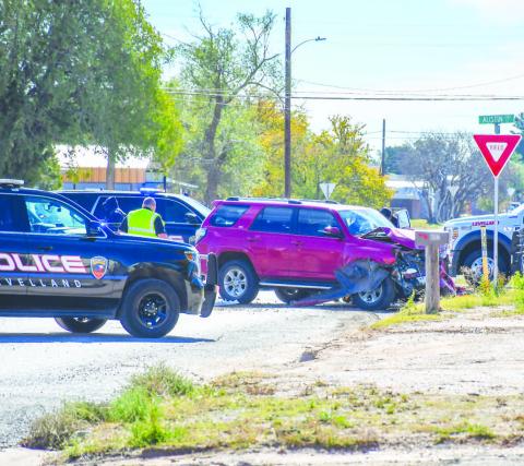 VEHICLE COLLISION - The Levelland Police Department (LPD), Levelland Fire Department (LFD) and Levelland Emergency Medical Services (EMS) responded to the 200 block of Austin Street Friday around noon after a report of a two vehicle collision. Details of the collision are unknown as of publishing. An update will be made when more information is available. (Staff photo by Evin Thomas)