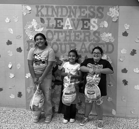 CAPITOL ELEMENTARY TURKEY TROT--The Capitol Elementary Parent Club recently held a Turkey Trot for Capitol students during their P.E. classes. Families could pay $1 to buy raffle tickets for a chance to win a free turkey for one student per grade level. All proceeds went to the Capitol Elementary Parent Club. Pictured from left to right: 4th grade winner Annalise Sanchez, 2nd grade winner Elsy Huerta, and 3rd grade winner Serenity Butler (photo courtesy of Capital Elementary)