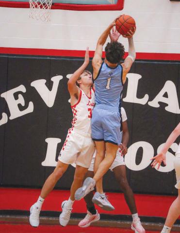 NO EASY SHOTS - Levelland Lobo Gage French contested the shot down low under the basket against the Greenwood Rangers last Tuesday at home. (Staff photo by Aalijah Soliz)