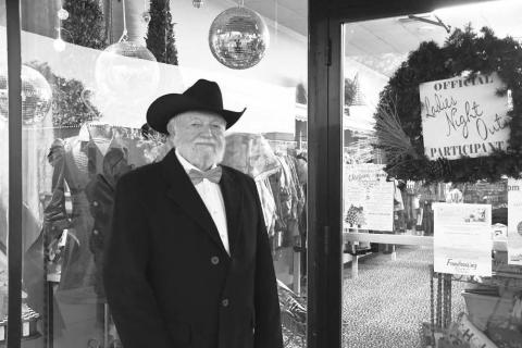 YOUR SHOP DOORMAN – Prentice Fred was suited up to open doors for Ladies Night Out visitors of Your Shop in downtown Levelland on Thursday night. (Staff photo by Evin Thomas)