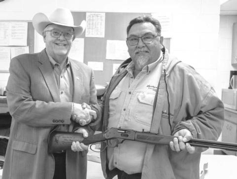 43 YEARS OF SERVICE--Arthur Chapa retired from Lyntegar Electric after 43 years of service. Arthur was gifted a shot gun for his retirement gift. Pictured is Arthur Chapa and Lyntegar Electric CEO Greg Henley. (Submitted photo).