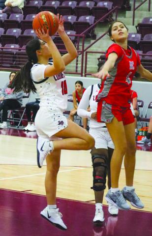 LAYUP - Levelland Loboette Emily Perez shot the ball with momentum driving into the paint during the team’s game against Denver City in the Littlefield Tournament. (Staff photo by Aalijah Soliz)