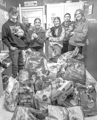 NHS SUPPORTS ANIMAL SHELTER - LHS National Honor Society's January Community Service Project was geared towards helping animals. The group bought 420 pounds of dog and cat food for the Levelland Animal Shelter. The NHS Officers: Ethan Parkinson, Emily Perez, Tea Johnson, and Addisen Campbell delivered the food last week. Pictured are Ethan Parkinson, Emily Perez, Tea Johnson and Addisen Campbell with Animal Control Officers Julianna Warnock and Taylor Perez and puppies waiting to be adopted. For more inform