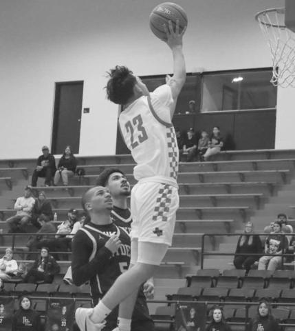 HIGH RISER - Levelland Lobo Ozzie Solano jumped high to get his team a good look during the team’s win against Snyder this past Tuesday night at home. (Staff photo by Aalijah Soliz)